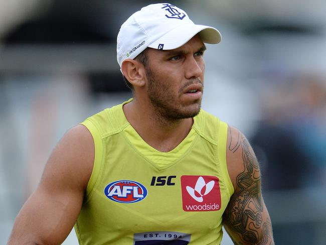 SPORT - The Fremantle Dockers train ahead of their season opener on Sunday. Photo by Daniel Wilkins. PICTURED- Harley Bennell walks the boundary during training