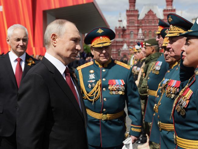 Russia's President Vladimir Putin greets military commanders after the Victory Day military parade at Red Square in central Moscow earlier this month. Picture: AFP