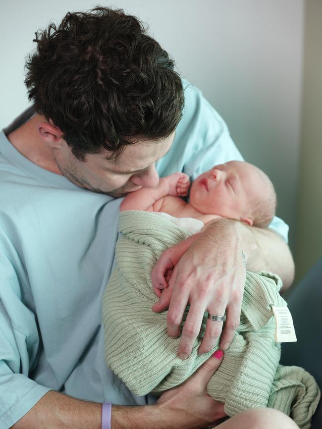 Lachie Neale with his new baby son Freddie. Picture: Annette Dew