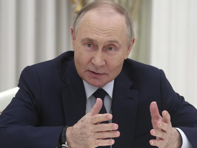Russian President Vladimir Putin gestures while speaking to Alexander Troufanov, Yelena Troufanova and Sapir Cohen, who were released from Hamas captivity, during their meeting at the Kremlin, in Moscow, Russia, on Wednesday, April 16, 2025. (Sofia Sandurskaya, Sputnik, Kremlin Pool Photo via AP)