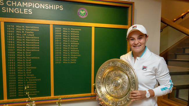 Barty poses with the Venus Rosewater Dish trophy and the Wimbledon Ladies’ Singles Board now etched with her name. Picture: Getty