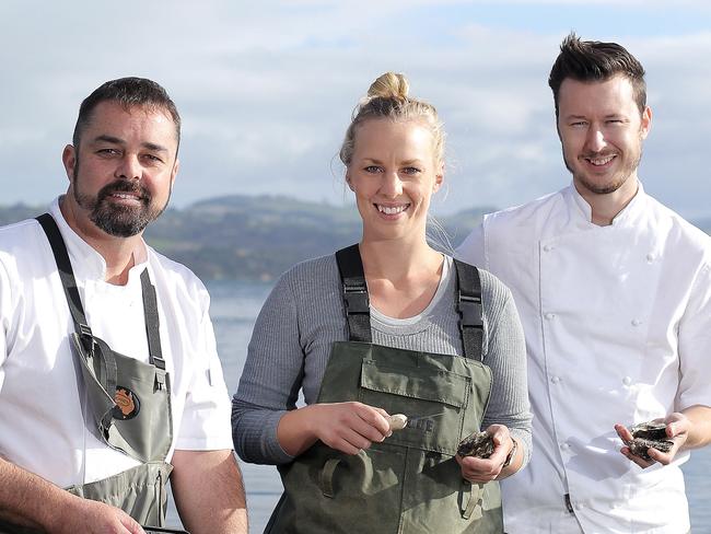 TAS WEEKEND: Harvest shoot: Blackman Bay Oyster Farm co-owner, Isabelle Clarkson (centre) with Hobart restaurant, Aloft chefs, Glenn Brynes (centre) and Christian Ryan at Blackman Bay PICTURE: Luke Bowden