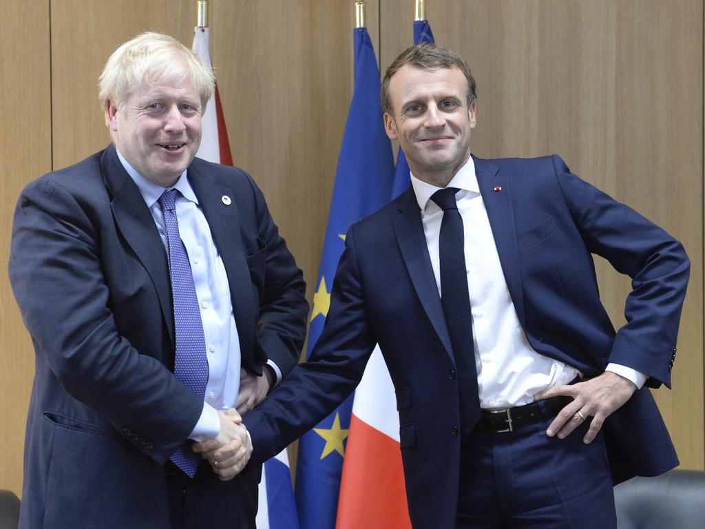 Britain's Prime Minister Boris Johnson shakes the hand of French President Emmanuel Macron, who supports the Brexit deal. Picture: Johanna Geron/Pool via AP