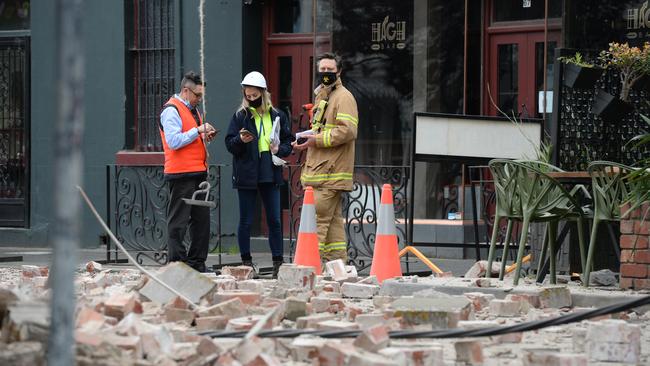 Emergency crews survey the damage on Chapel St. Picture: Andrew Henshaw