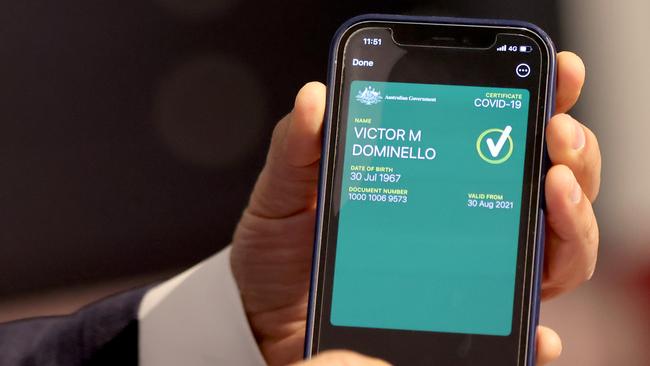 Customer Service Minister Victor Dominello pictured showing how a vaccine passport will look on an app. Picture: NCA NewsWire / Damian Shaw