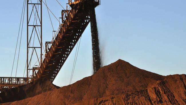 stock mining pics Iron ore being stockpiled at Fortescue Metals Group's first mine, Cloudbreak, about 280km southeast of Port Hedland in Western Australia. AAP Image/Rebecca Le May (NO ARCHIVING) * The pics were taken on a media tour on Monday.