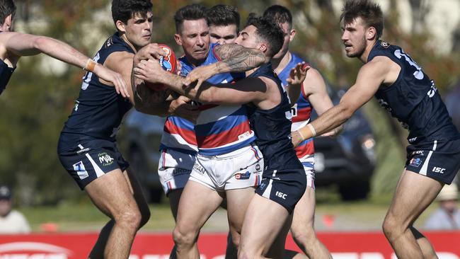 Central’s James Boyd is mobbed by Panthers at Noarlunga. Picture: Naomi Jellicoe