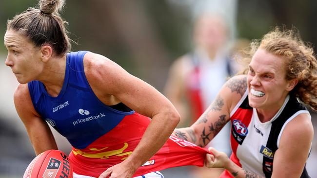 Saints toughnut Tilly Lucas-Rodd, tackling Lion Emily Bates, tried her guts out in the heartbreaking loss. Picture: Michael Klein