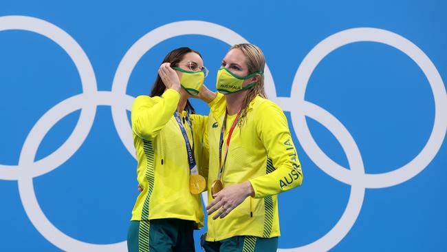 Gold medalist Kaylee McKeown and bronze medalist Emily Seebohm embrace on the podium. Picture: Clive Rose/Getty Images