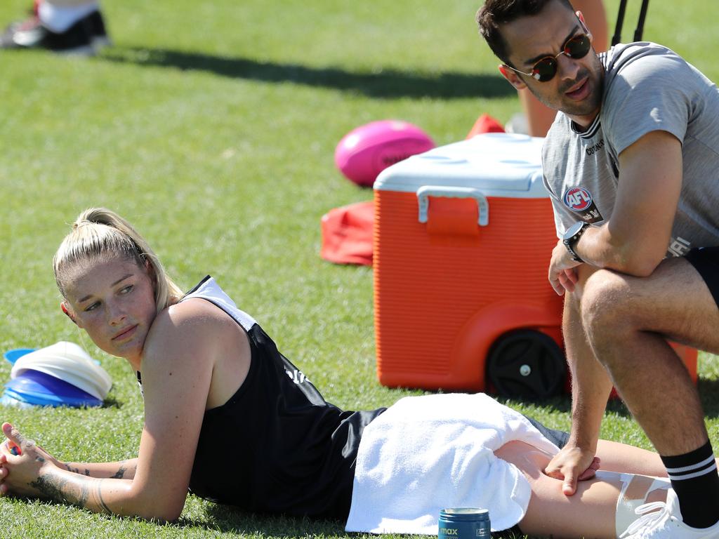 Tayla Harris gets her left hamstring massaged before leaving the track early. Picture: Michael Klein