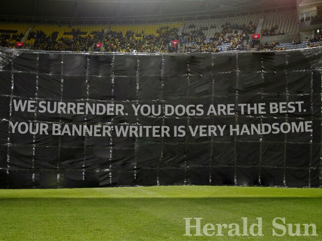 Some humble words for Collingwood supporters by Danny McGinlay, who, completely coincidently, is the Dogs’ banner writer.