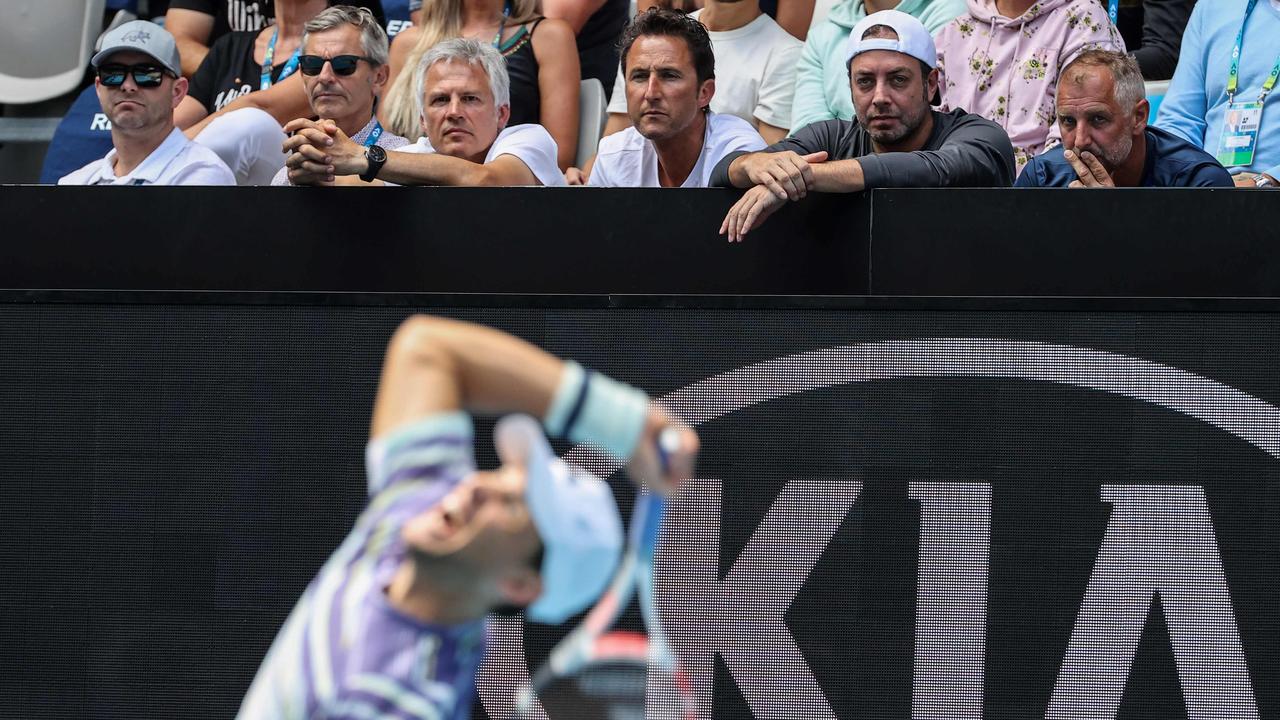 Thomas Muster and Nicolas Massu watch Dominic Thiem at the Australian Open.
