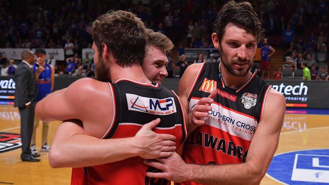 Te Illawarra Hawks players reacts after beating Adelaide 36ers in the semi-final decider.