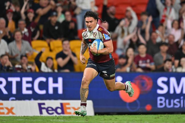 Dre Pakeho of the Reds makes a break in his breakout Super Rugby campaign. Photo by Albert Perez/Getty Images.