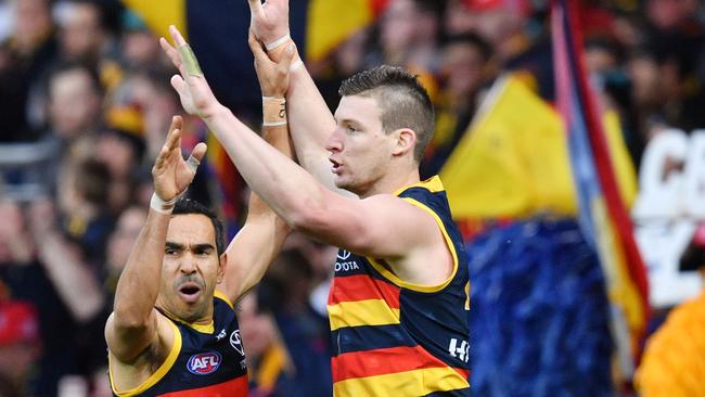 Josh Jenkins celebrates a goal with Crows teammate Eddie Betts. Picture: AAP Image/David Mariuz