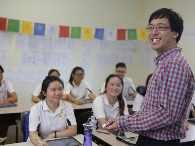 Tutor Dr Min Zhao Lee, a doctor at RPA Hospital, teaching students at Pal Buddhist School.