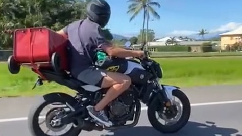 The big question is: How does he change gears while his clutch hand is holding the bin? Picture: Mark Fenton Sanderson