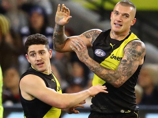 MELBOURNE, AUSTRALIA - AUGUST 03:  Dustin Martin of the Tigers and Jason Castagna of the Tigers celebrate after  a goal during the round 20 AFL match between the Richmond Tigers and the Geelong Cats at Melbourne Cricket Ground on August 3, 2018 in Melbourne, Australia.  (Photo by Scott Barbour/Getty Images)