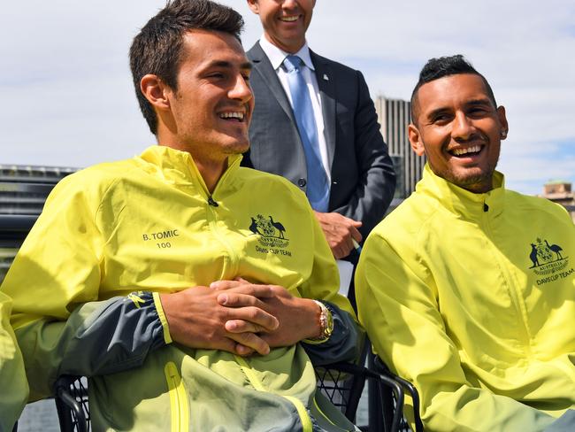 (FILES) This file photo taken on September 15, 2016 shows Australia Davis Cup tennis team players Bernard Tomic (L) and Nick Kyrgios attending the official draw for their tie against Slovakia in Sydney. Tomic says he and fellow fiery Australian Kyrgios will always be "just a bit crazy" and people should get used to it. The controversial pair have frequently fallen foul of tennis authorities and have a love-hate relationship with the public. / AFP PHOTO / William WEST