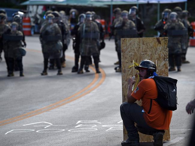 A man confronts police and military personnel. Picture: AFP