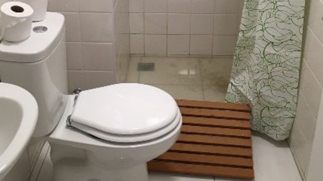 The drainage system was now working as mucky water filled the shower floor. Picture: Belarus Olympic Committee