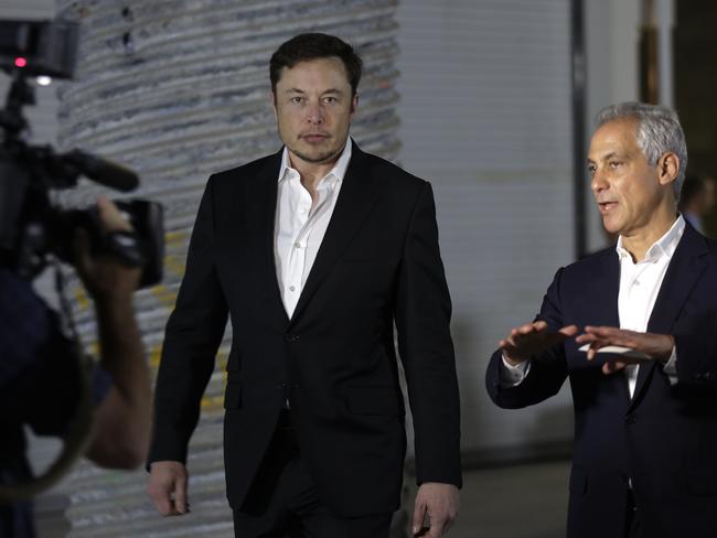 Tesla CEO and founder of the Boring Company Elon Musk, left, and Chicago Mayor Rahm Emanuel arrive at a news conference, Thursday, June 14, 2018, in Chicago. The Boring Company has been selected to build a high-speed underground transportation system that it says will whisk passengers from downtown Chicago to O'Hare International Airport in mere minutes. Picture: Kiichiro Sato