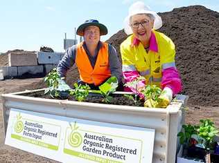 Mayor Jenny Dowell and Waste Operations Coordinator Kevin Trustum planting a vegetable garden using the certified organic compost. Picture: Contributed