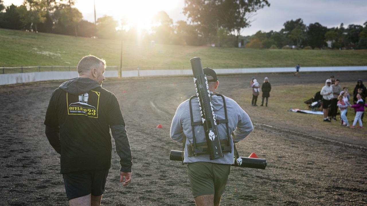 Spartans team members Des Brosnan (left) and Geordie Horn (carrying an extra 40kg) in 40 for Fortey at Toowoomba Showgrounds, Sunday, June 2, 2024. Picture: Kevin Farmer