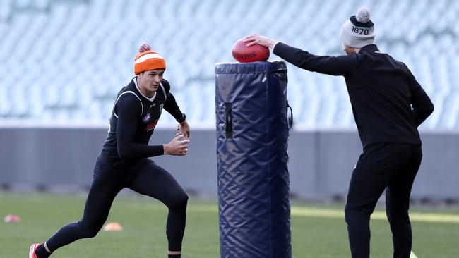 Ryan Burton attacks the tackling bag at Port Adelaide training last week. Picture: Sarah Reed