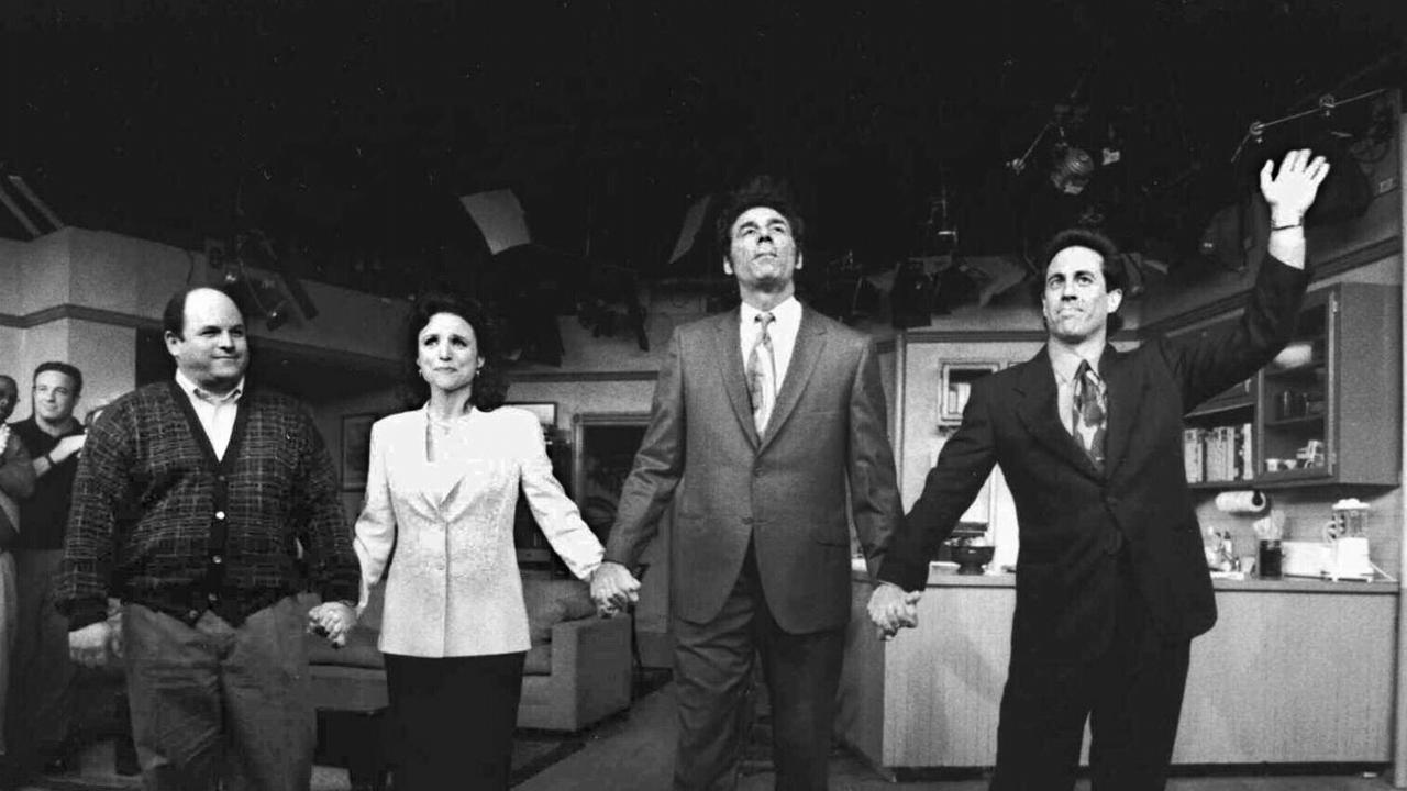 Jason Alexander with Julia Louis-Dreyfus, Michael Richards and Jerry Seinfeld waving goodbye after filming of the series' final episode.