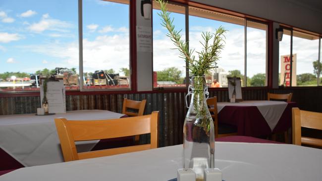 Inside the Oasis Exchange Hotel as a road train pulls up outside and comes in for a hot lunch.