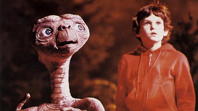 Actor Henry Thomas and ET in scene from film ET: The Extra-Terrestrial.