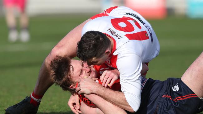 Colin Garland (Clarence) tackles Austin Keeling (North Hobart). Picture: Nikki Davis-Jones