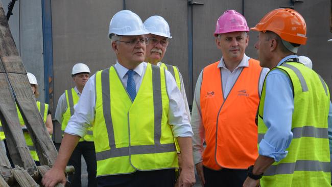 Prime Minister Scott Morrison, Federal MP for Leichhardt Warren Entsch, Mike Steen, head of in service support for Austal, and Norship chief executive Olav Groot. Picture: Bronwyn Farr.