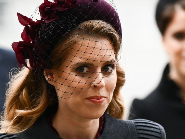 Britain's Princess Beatrice of York (L) and her sister Britain's Princess Eugenie of York arrive to attend a Service of Thanksgiving for Britain's Prince Philip, Duke of Edinburgh, at Westminster Abbey in central London on March 29, 2022. - A thanksgiving service will take place on Tuesday for Queen Elizabeth II's late husband, Prince Philip, nearly a year after his death and funeral held under coronavirus restrictions. Philip, who was married to the queen for 73 years, died on April 9 last year aged 99, following a month-long stay in hospital with a heart complaint. (Photo by Daniel LEAL / AFP)