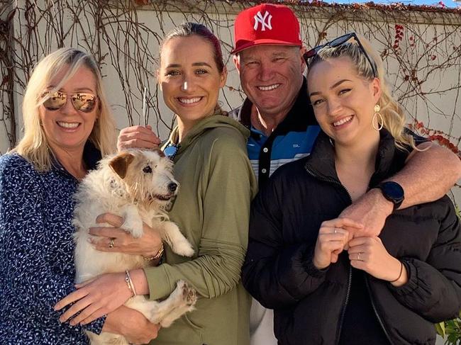 The late Australian cricket great Dean Jones with former wife Jane (left), daughters Phoebe (second from left), Augusta (right) and their Jack Russell Terrier Trevor. Picture: Instagram