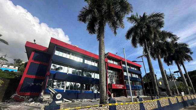 The severely damaged building housing the embassies of the United States, Britain, and New Zealand after the powerful earthquake struck Vanuatu's capital Port Vila on December 17. Picture: Australian Department of Foreign Affairs and Trade / AFP