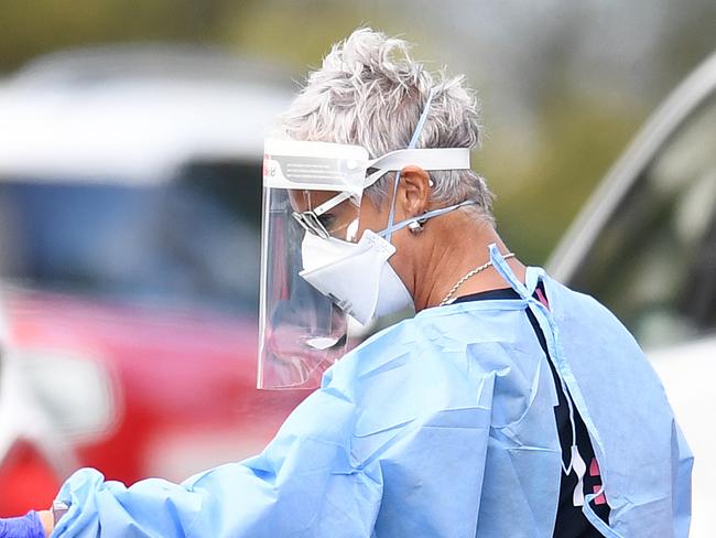 BRISBANE, AUSTRALIA - NewsWire Photos - SEPTEMBER 30, 2021.A health worker processes members of the public at a drive through Covid-19 testing clinic at Murarrie in Brisbane. Picture: NCA NewsWire / Dan Peled