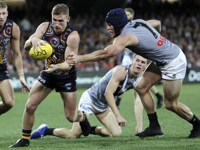 AFL - SHOWDOWN 47 - Adelaide Crows v Port Adelaide at the Adelaide Oval. Rory Laird under pressure from Brad Ebert. Picture SARAH REED