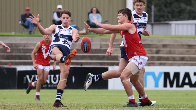 NEWS SPORT. SouthÃ¢â¬â¢sTom Weaton kicks out of danger.Under-16 SANFL semi final between North Adelaide and South Adelaide Image/Russell Millard