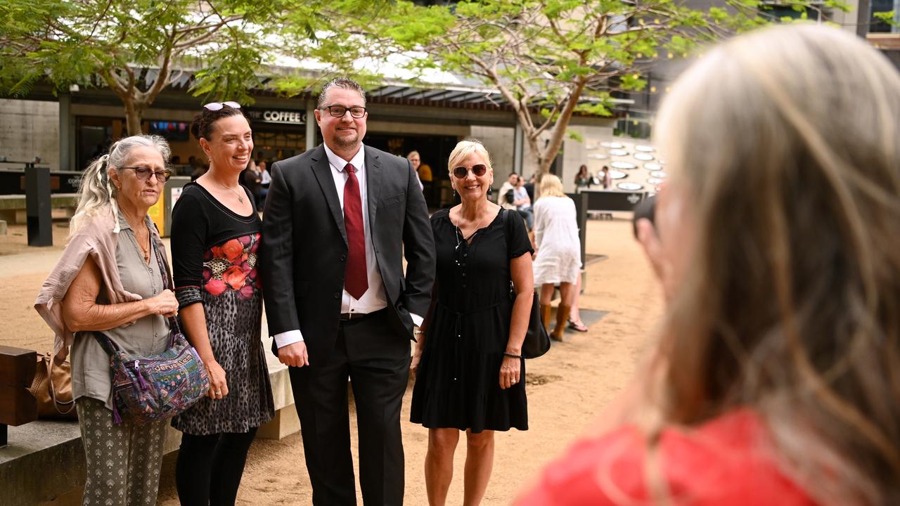 Mr Bay poses for a picture with a group of supporters outside court before his hearing. Picture: NCA NewsWire / Dan Peled
