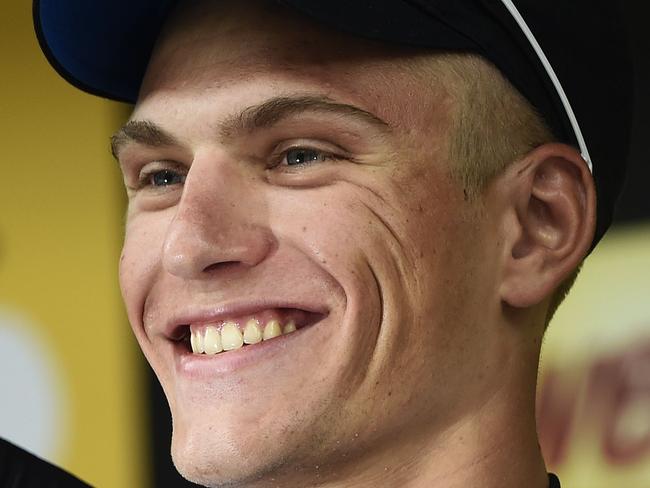 Stage winner Germany's Marcel Kittel celebrates on the podium after winning the 155 km third stage of the 101st edition of the Tour de France cycling race on July 7, 2014 between Cambridge and London, southwestern England. AFP PHOTO / ERIC FEFERBERG