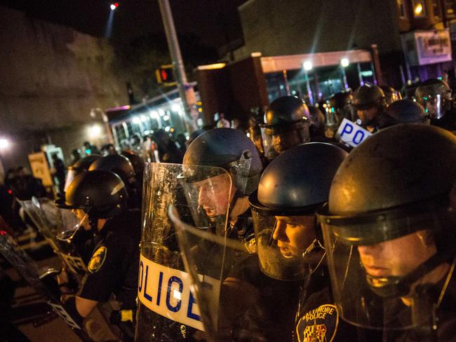 Violence ... Riot police advance on protesters and media during protests in the Sandtown neighborhood where Freddie Gray was arrested in Baltimore, Maryland. Picture:  Getty