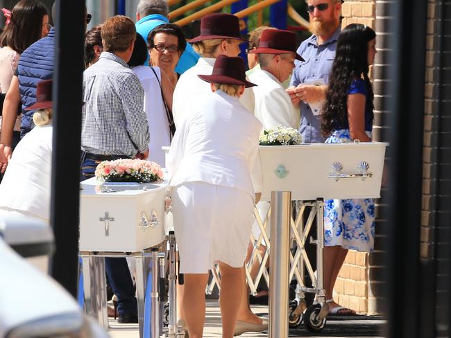 The two, small, white coffins of the children are taken into the church. Picture: Adam Taylor