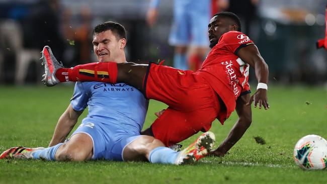Curtis Good of Melbourne City and Pacifique Niyongabire of United collide as they compete for the ball at ANZ Stadium. Picture: Getty Images