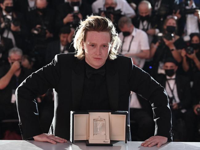 American actor Caleb Landry Jones poses with his Best Actor award for Nitram at the Cannes Film Festival. Picture: AFP