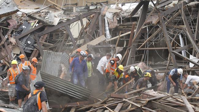 Rescuers search for survivors in a collapsed building in Manchester St in central Christchurch on February 22, 2011. Picture: Martin Hunter/Getty Images