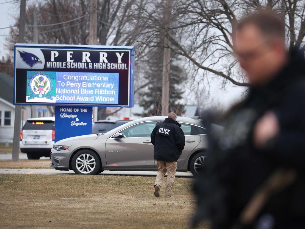 An officer outside Perry High School.