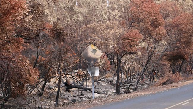 Melted signs on a road in the west of Kangaroo Island following the 2019/20 bushfires. Picture: Daniel Clarke.