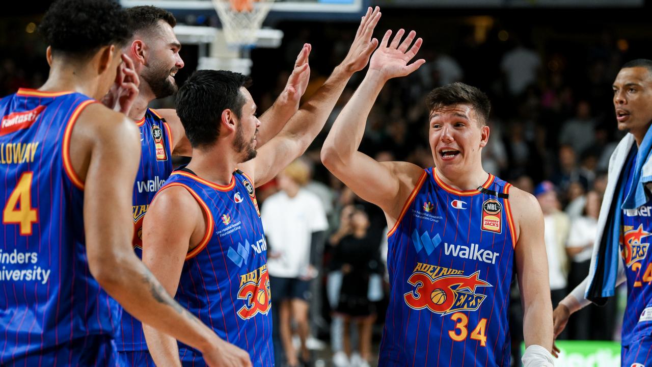 Jason Cadee and Dejan Vasilkjevic of the 36ers celebrates a win on Friday night. Picture: Mark Brake/Getty Images.